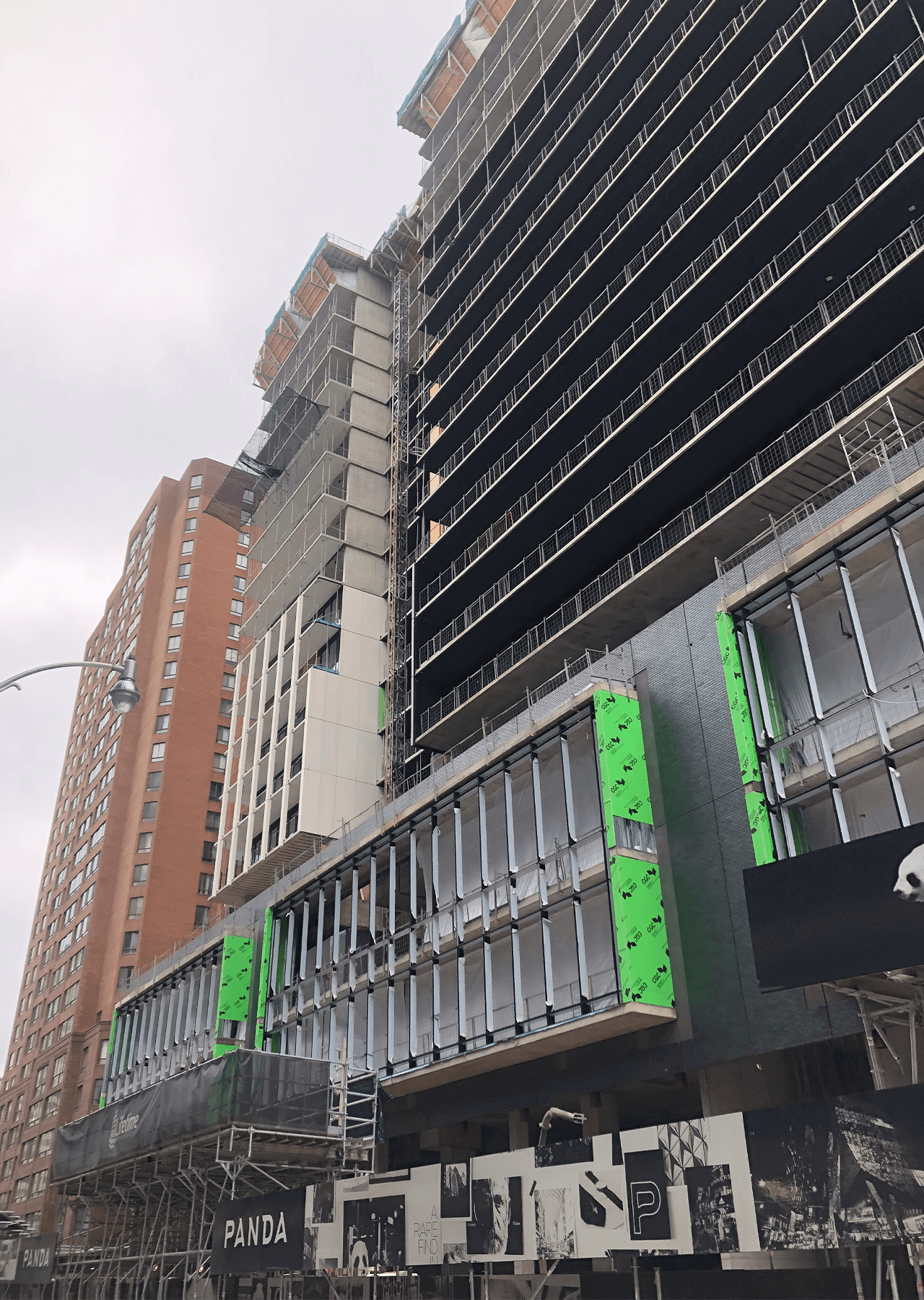 building under construction installing windows