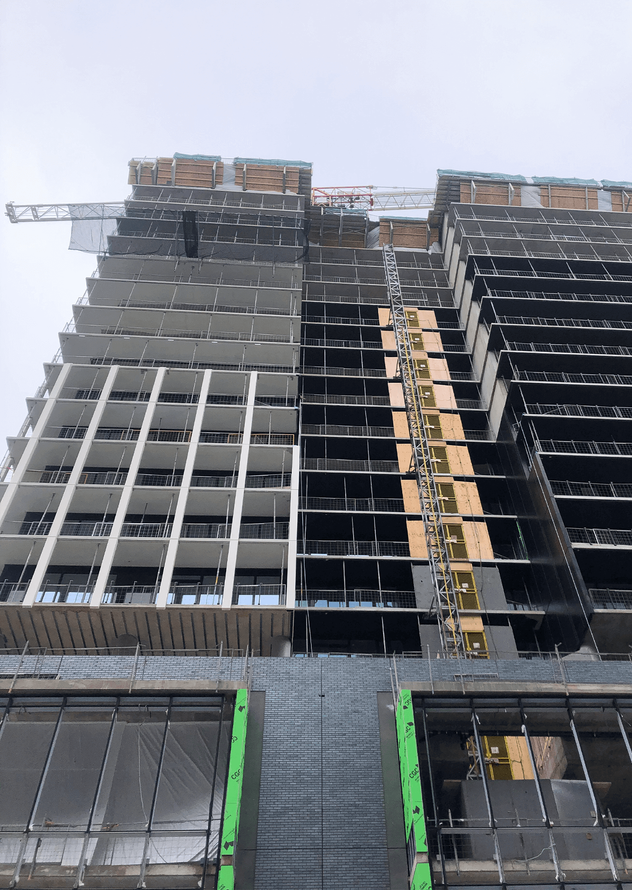 building under construction installing windows