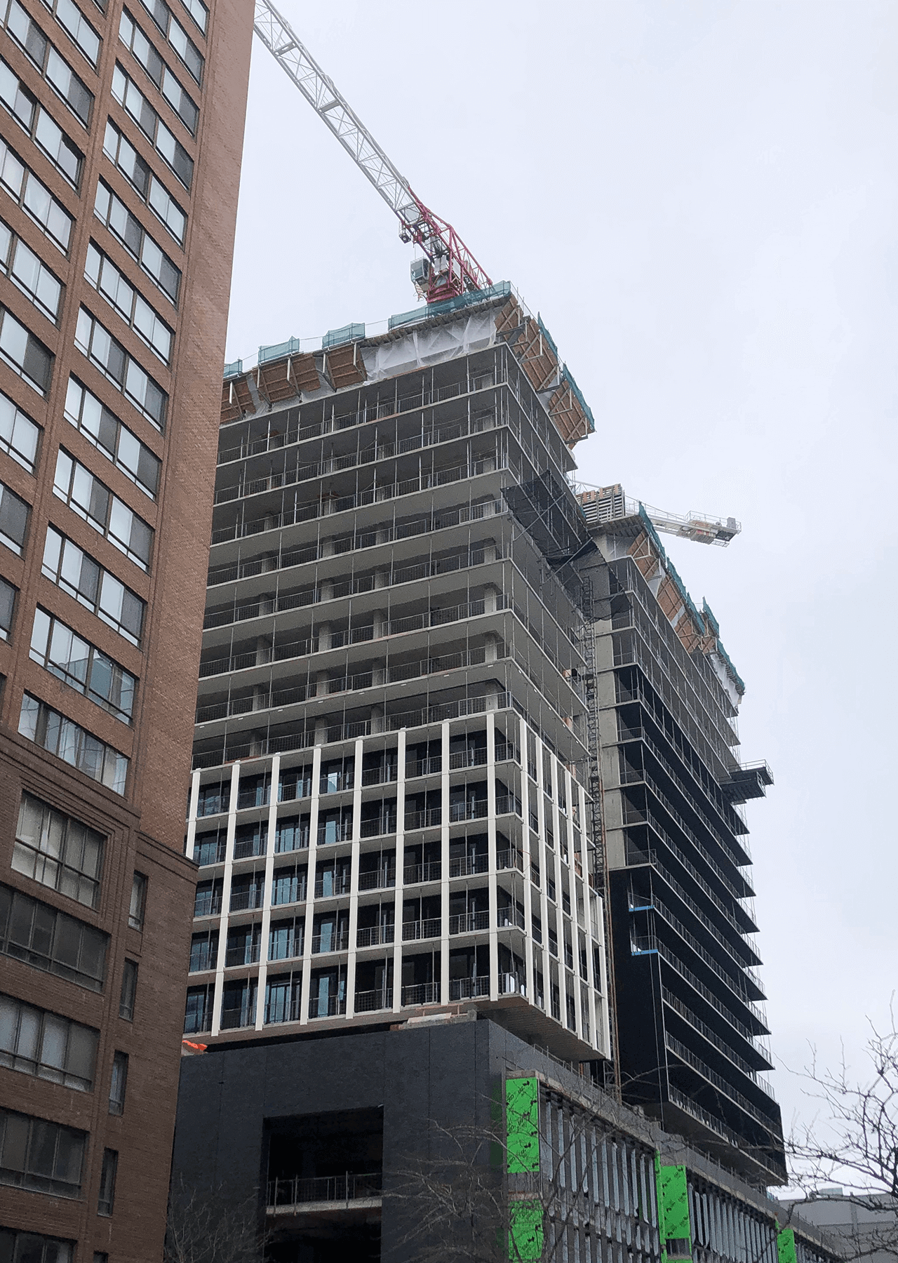 building under construction installing windows