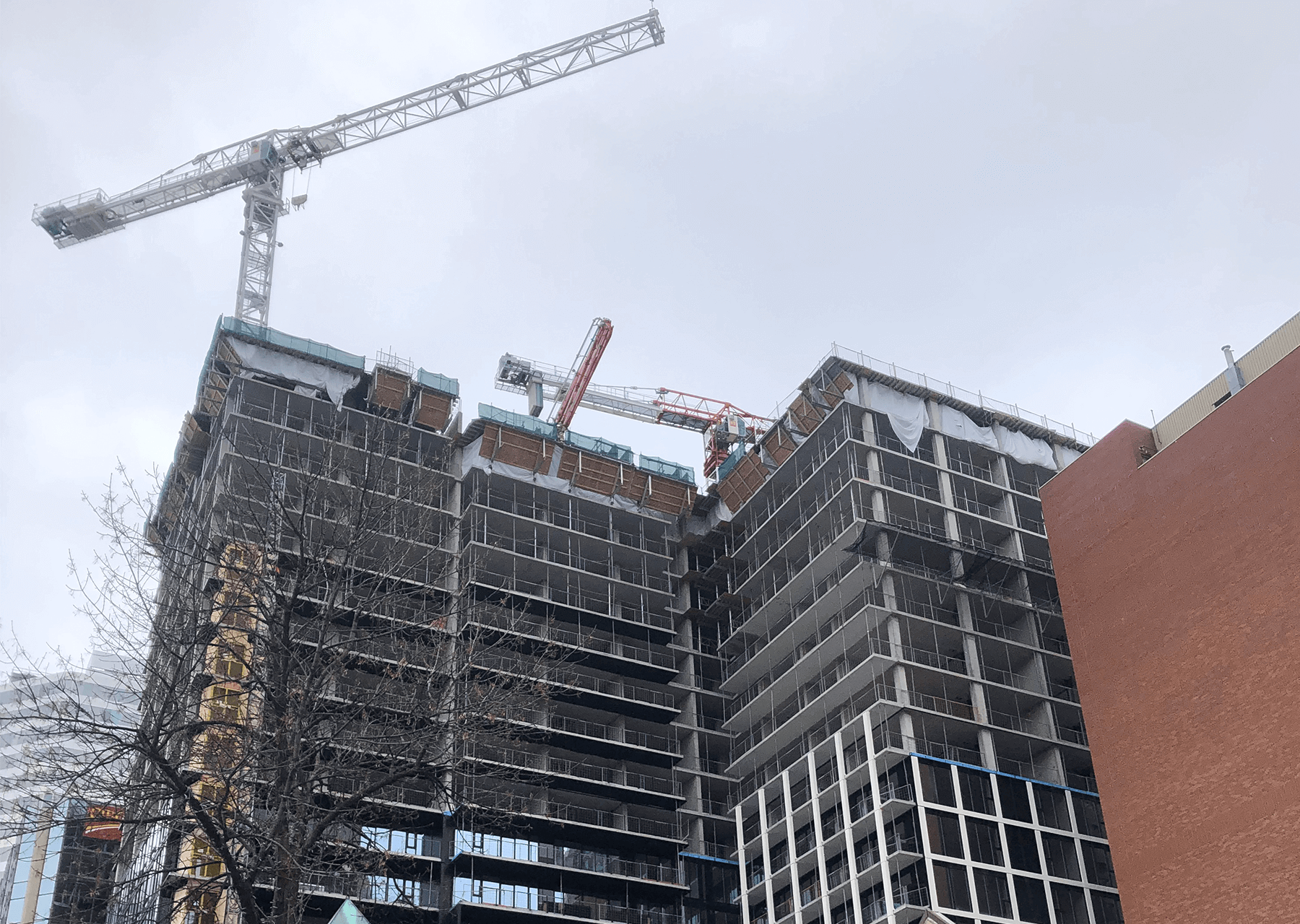 building under construction installing windows