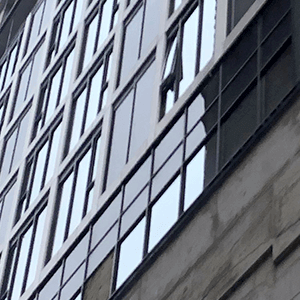 close up of windows on a building that is under construction